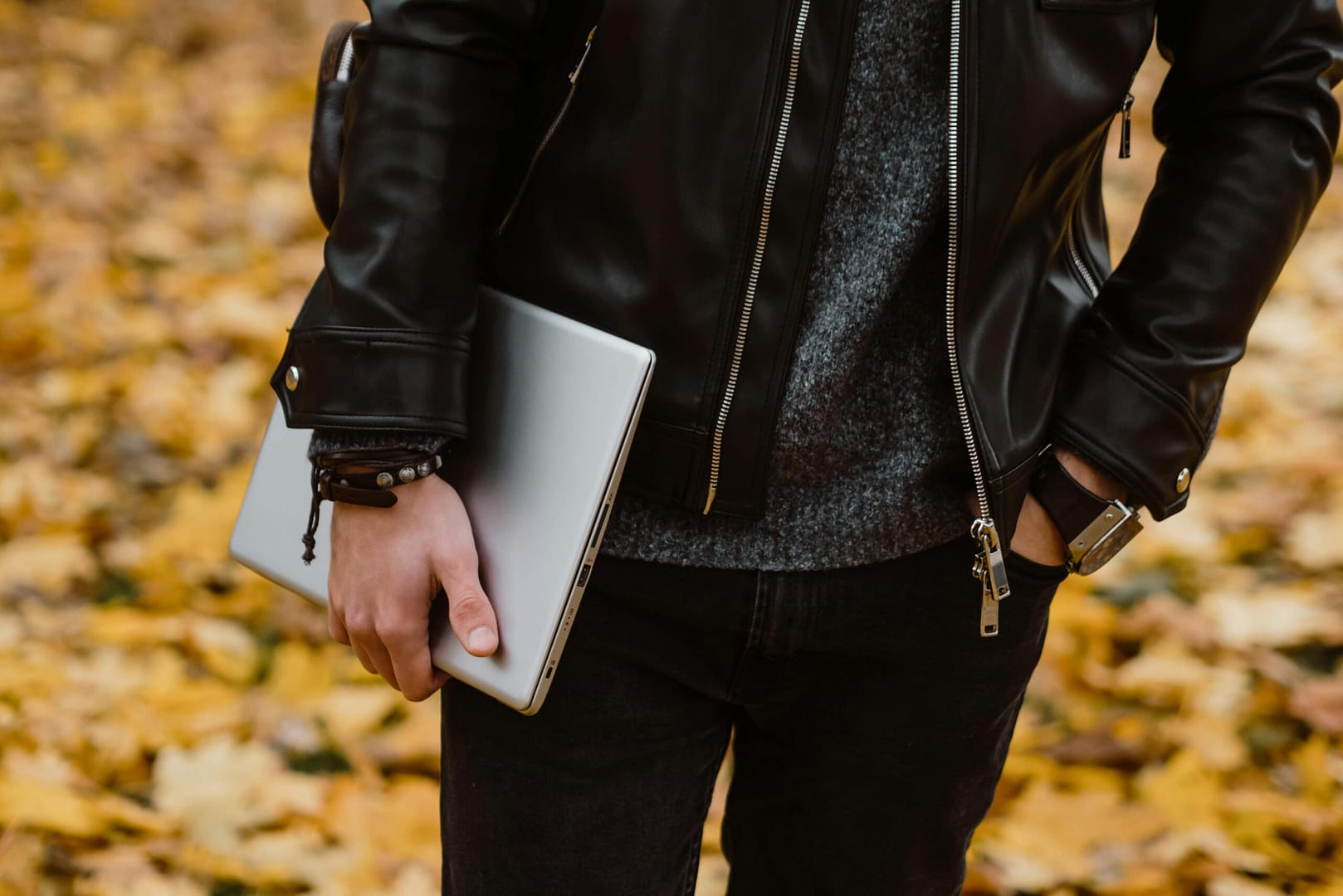 Photograph of the torso of a person holding a laptop to illustrate the question what is a litigant in person