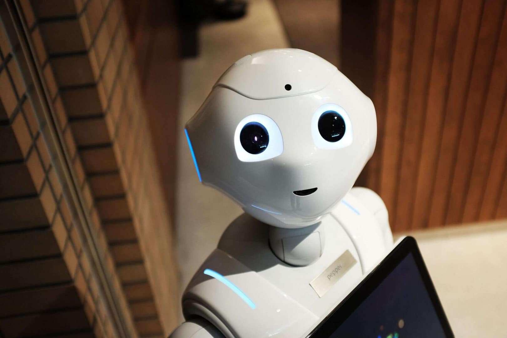 Photograph of a robot looking up at the camera demonstrating AI in law