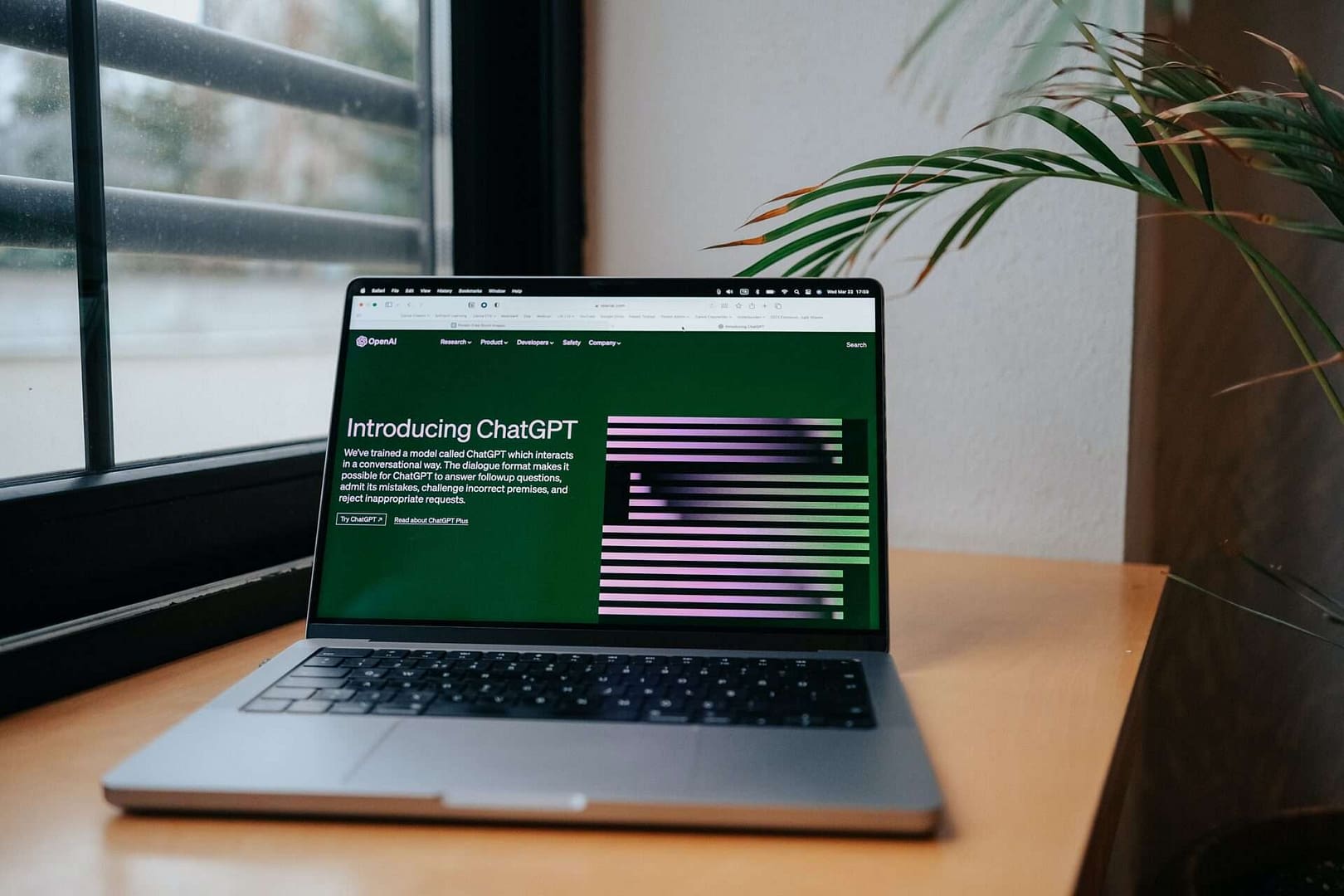 Photograph of a laptop on a desk to illustrate AI in legal tech